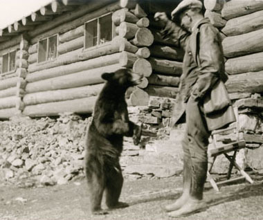 Man playing with bear at Granite Chalet 