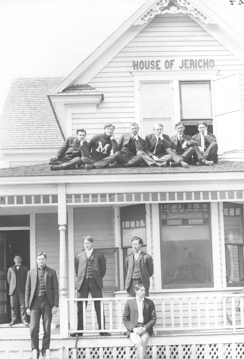 House of Jericho men gathered on roof and porch.