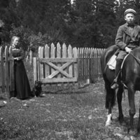 A boy sits on a horse