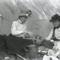 Mary L. Hege and Daisy in tent, Glacier