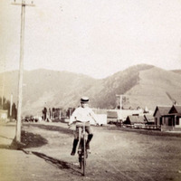 Carl H. on bicycle, Missoula, Montana. 